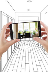 Image showing Hands Holding Smart Phone Displaying Photo of House Hallway Draw