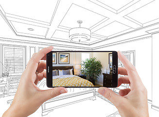 Image showing Hands Holding Smart Phone Displaying Photo of Bedroom Drawing Be