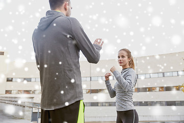 Image showing woman with coach working out strike outdoors