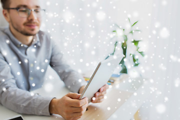 Image showing happy creative male office worker with tablet pc