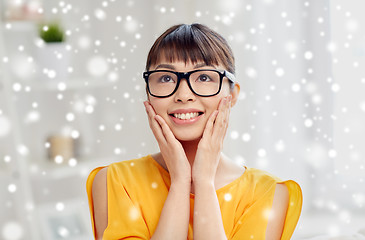 Image showing happy asian young woman in glasses at home