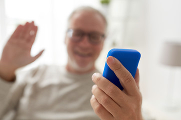 Image showing close up of man having video call on smartphone