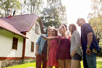 Image showing friends taking selfie at party in summer garden