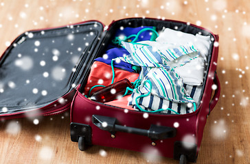 Image showing close up of travel bag with beach clothes