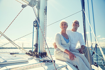 Image showing senior couple hugging on sail boat or yacht in sea