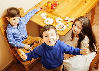 Image showing little cute boys eating dessert on wooden kitchen. home interior. smiling adorable friendship together forever friends, lifestyle people concept