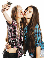 Image showing cute teenage girls making selfie isolated