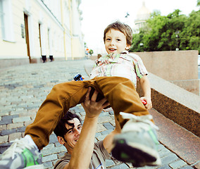 Image showing little son with father in city hagging and smiling