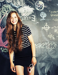 Image showing back to school after summer vacations, cute teen girl in classroom