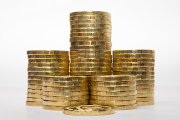 Image showing Six stacks of coins increasing height symmetrically on a white background