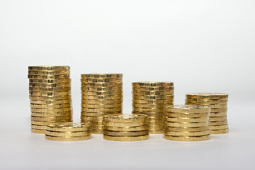 Image showing Seven coins columns mounted in two rows showing savings growth