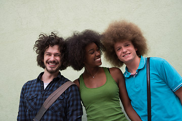 Image showing multiethnic group of happy three friends