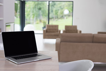 Image showing Notebook with blank screen on table