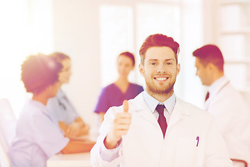 Image showing happy doctor over group of medics at hospital