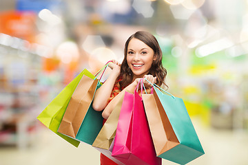 Image showing woman with shopping bags at store