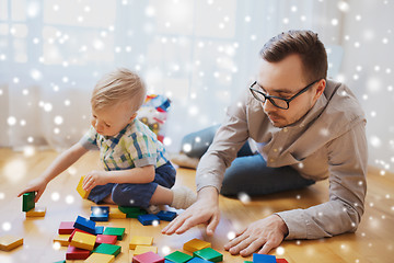 Image showing father and son playing with toy blocks at home