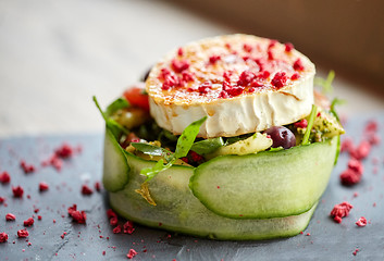 Image showing goat cheese salad with vegetables at restaurant