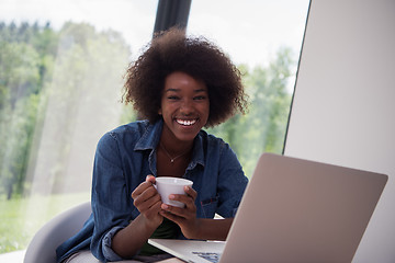 Image showing African American woman in the living room