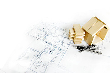 Image showing blueprint and wooden model of house