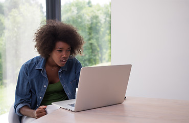 Image showing African American woman in the living room