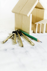 Image showing blueprints and wooden model of house