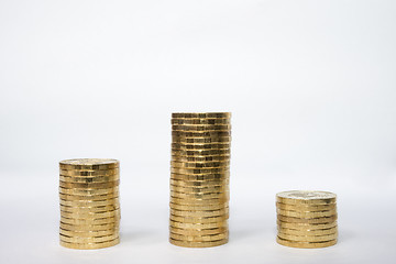 Image showing Three columns of coins similar to the podium