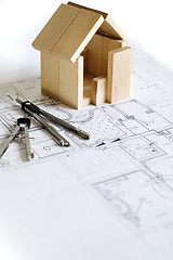 Image showing blueprint and wooden model of house