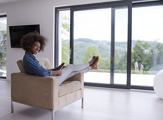 Image showing african american woman at home with digital tablet