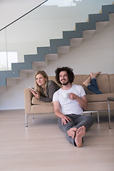 Image showing couple relaxing at  home with tablet computers