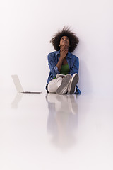 Image showing african american woman sitting on floor with laptop