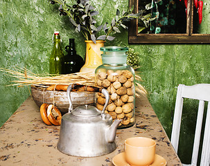 Image showing country kitchen with green walls and wood table, rural look