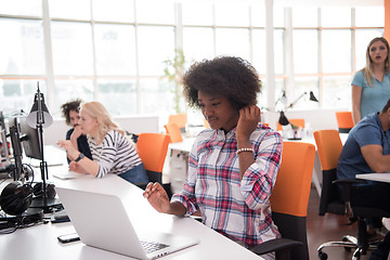 Image showing African American informal business woman working in the office