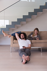 Image showing young couple relaxes in the living room