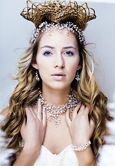 Image showing beauty young snow queen in fairy flashes with crown on her head