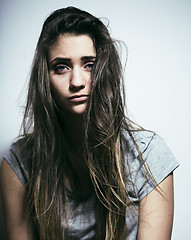 Image showing problem depressioned teenage with messed hair and sad face, real