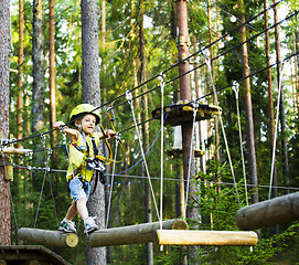 Image showing little cute boy in helmet runs track, leisure on nature