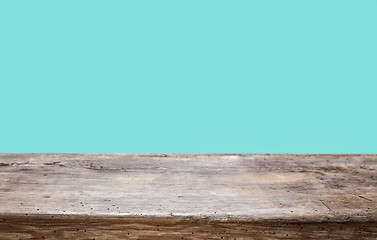 Image showing wooden table and blue background