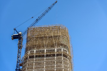 Image showing Construction of skyscrapers under blue sky