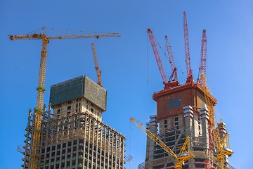 Image showing Construction of skyscrapers under blue sky