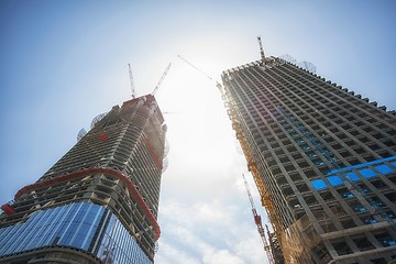 Image showing Construction of skyscrapers under blue sky