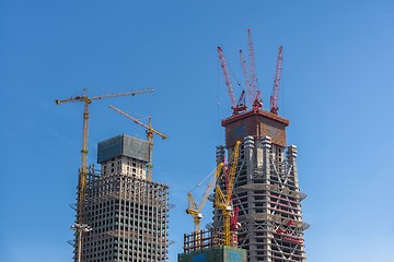 Image showing Construction of skyscrapers under blue sky