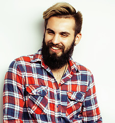 Image showing young handsome hipster bearded guy looking brutal isolated on white background, lifestyle people concept