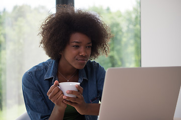 Image showing African American woman in the living room