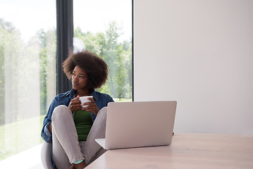 Image showing African American woman in the living room