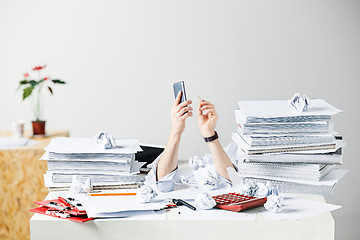 Image showing The many crumpled papers on desk of stressed male workplace