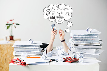 Image showing The many crumpled papers on desk of stressed male workplace