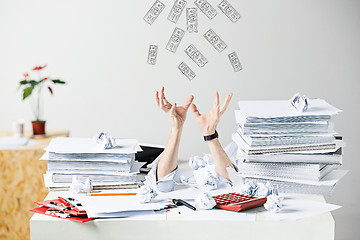 Image showing The many crumpled papers on desk of stressed male workplace