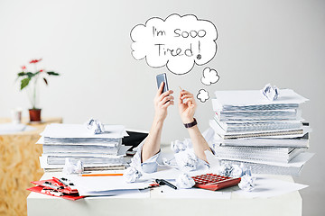 Image showing The many crumpled papers on desk of stressed male workplace