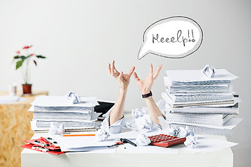 Image showing The many crumpled papers on desk of stressed male workplace