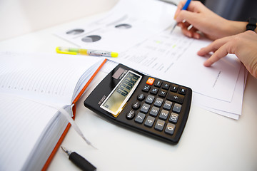 Image showing Accountant at table with papers